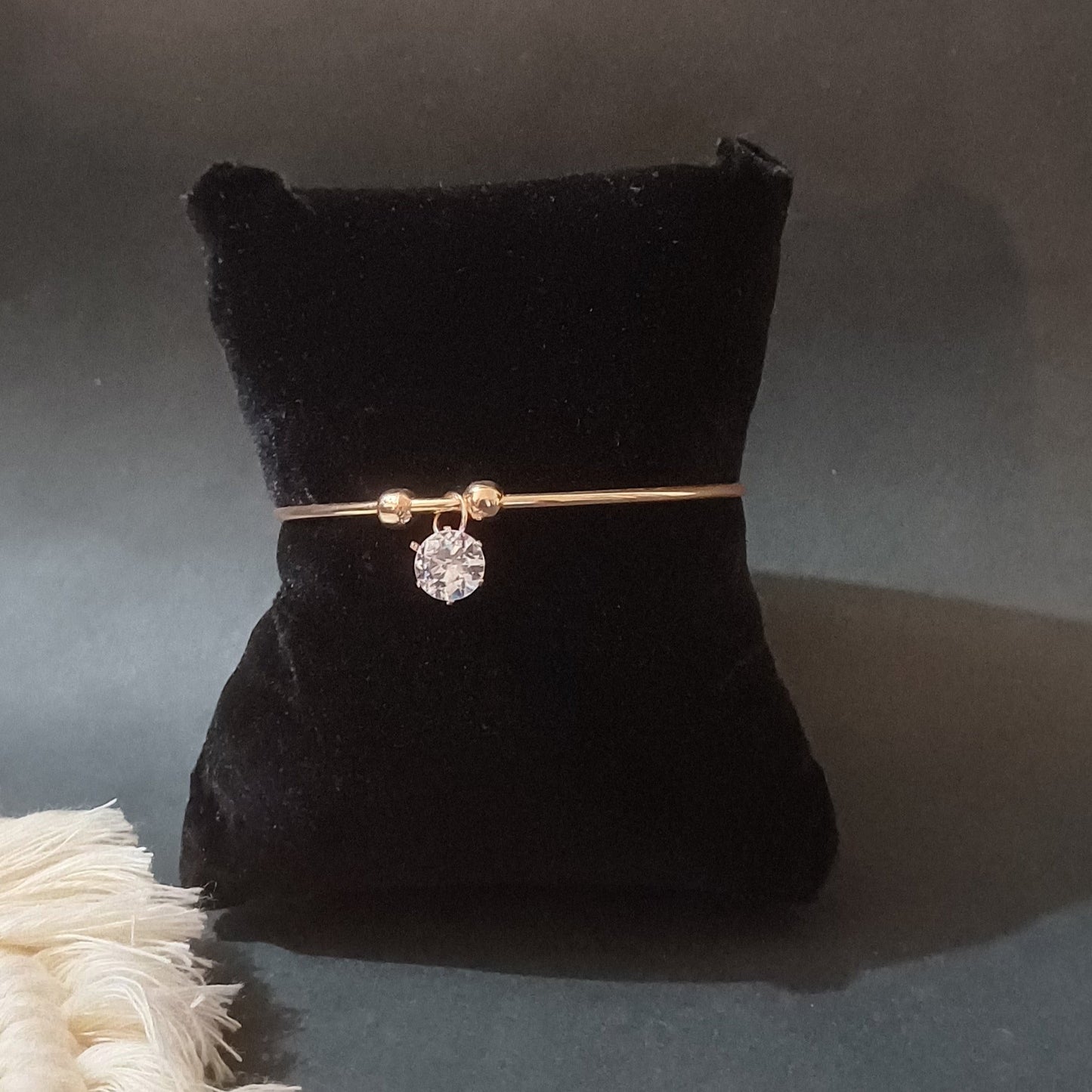 Round cut golden cuff bracelet with round solitaire