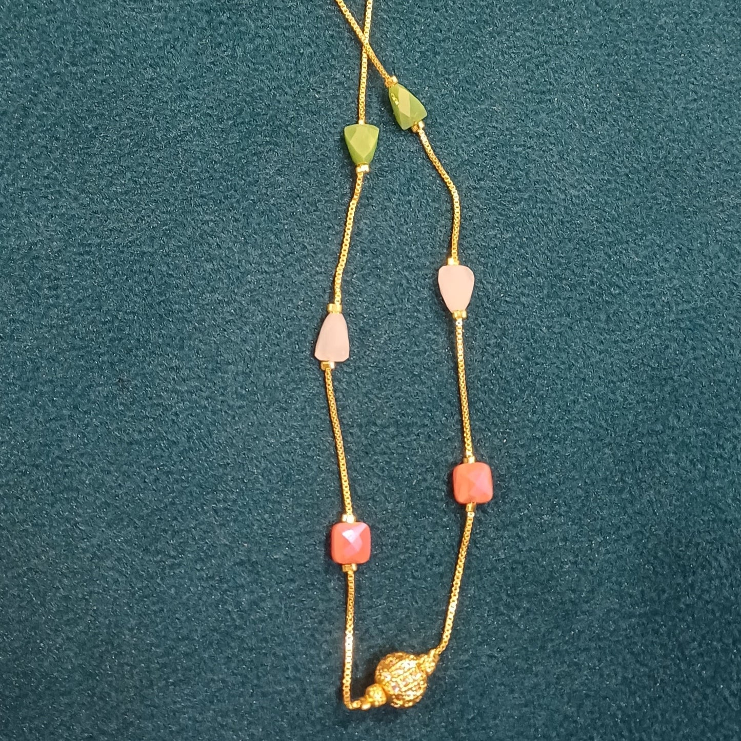 Necklace with multicolor beaded chain golden ball pendant