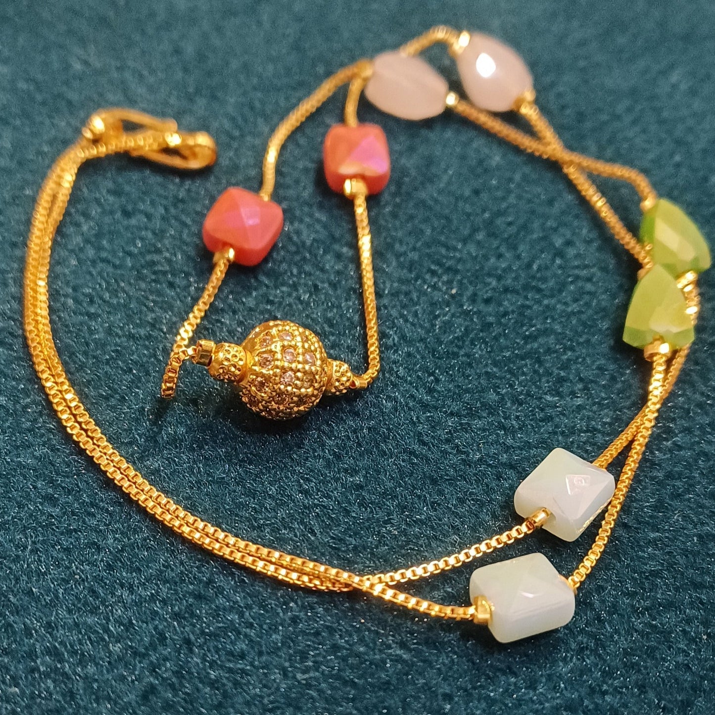 Necklace with multicolor beaded chain golden ball pendant