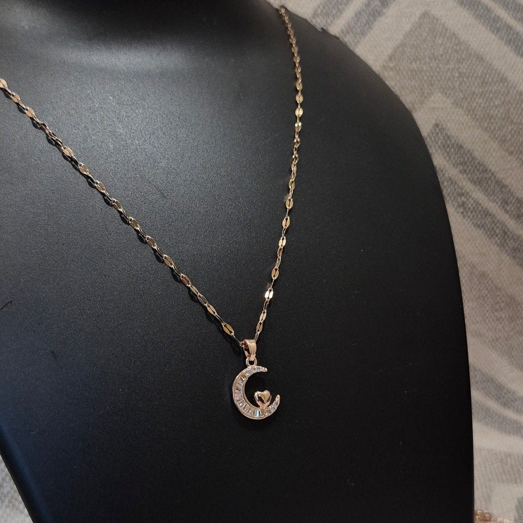 Half moon diamond pendant and braided chain