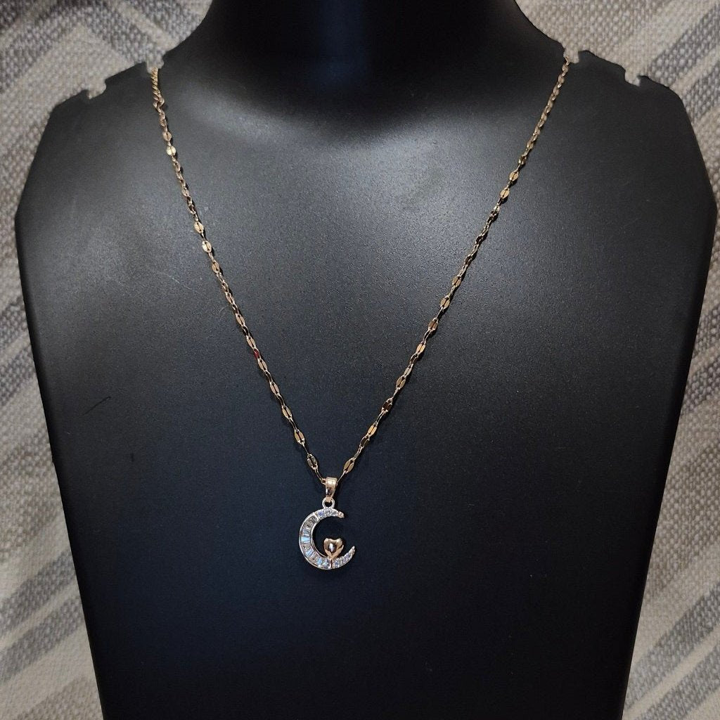 Half moon diamond pendant and braided chain