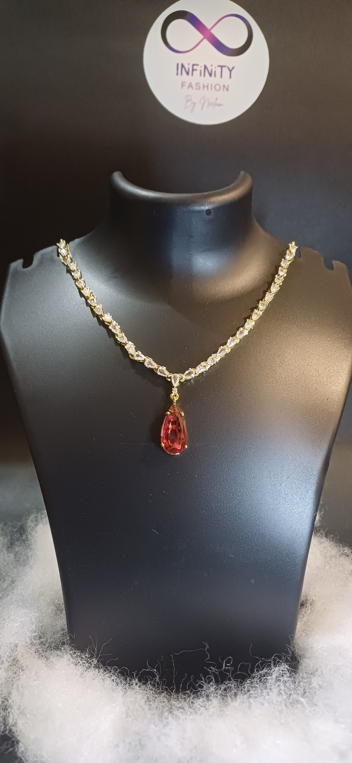 Red stoned Metallic golden single lined designer necklace with earrings