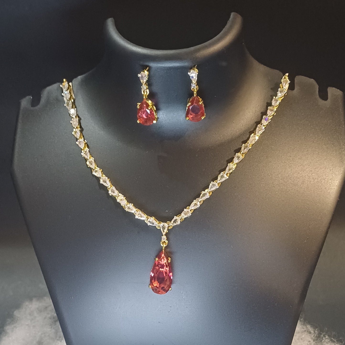 Red stoned Metallic golden single lined designer necklace with earrings