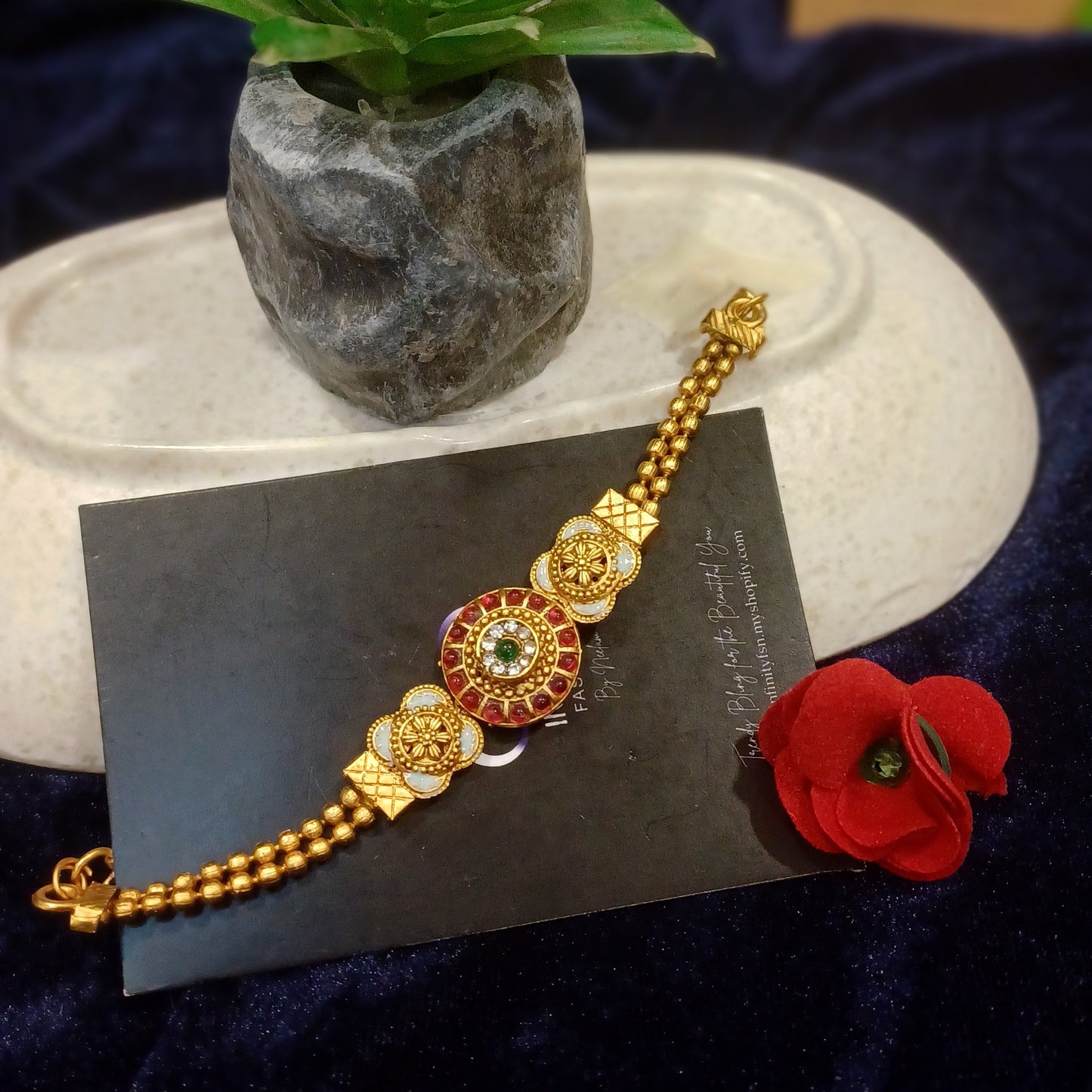 Ruby stoned golden bracelet balled loose straps_ designer