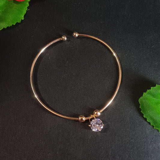 Round cut golden cuff bracelet with round solitaire