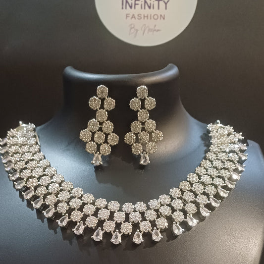 Diamond cluster silver hue band necklace with designer earrings