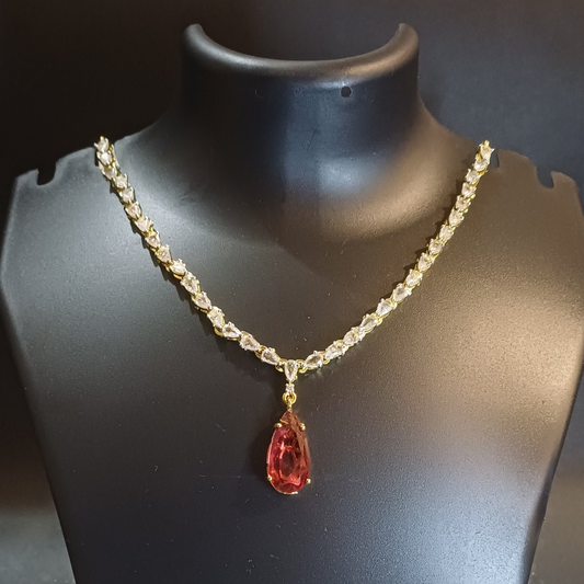 Red stoned Metallic golden single lined  designer necklace with earrings
