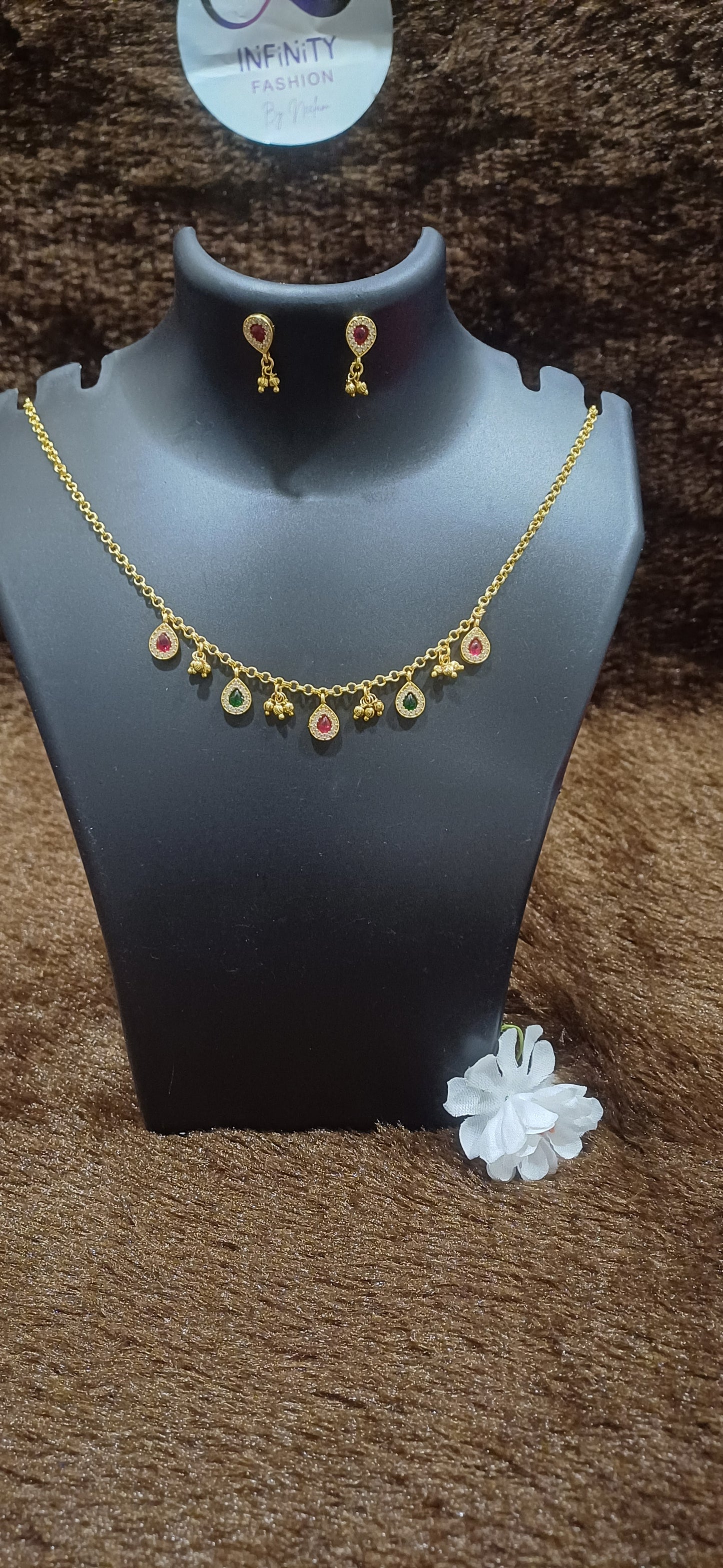Chain with rhinestoned tear drops and balls hanging with matching earrings